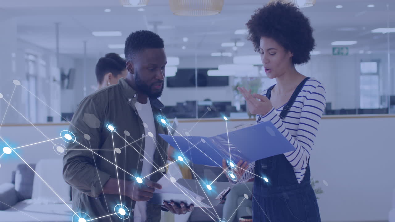 Animation of connections with icons over diverse business people in office