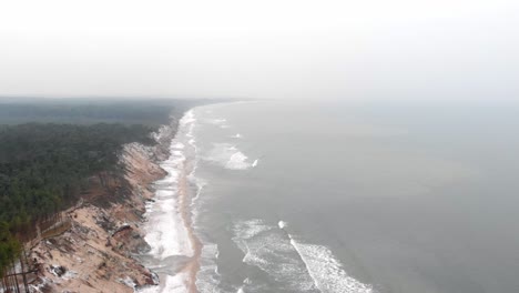 Aerial-shot-of-sandy-beach-in-Ustka-in-winter