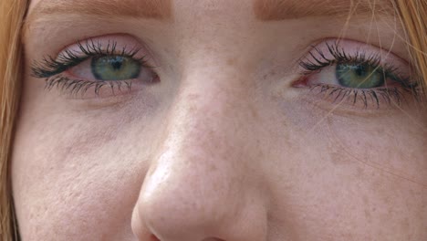 Close-up-on-red-haired-woman-face-with-eyes-and-nose