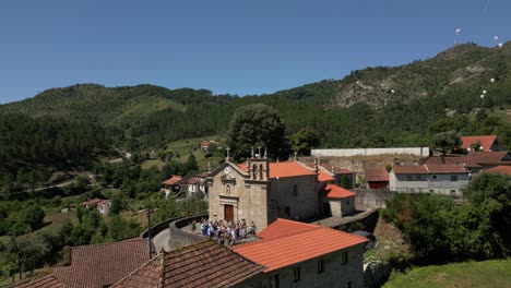 church gathering with balloons released into sky near cabril village, montalegre