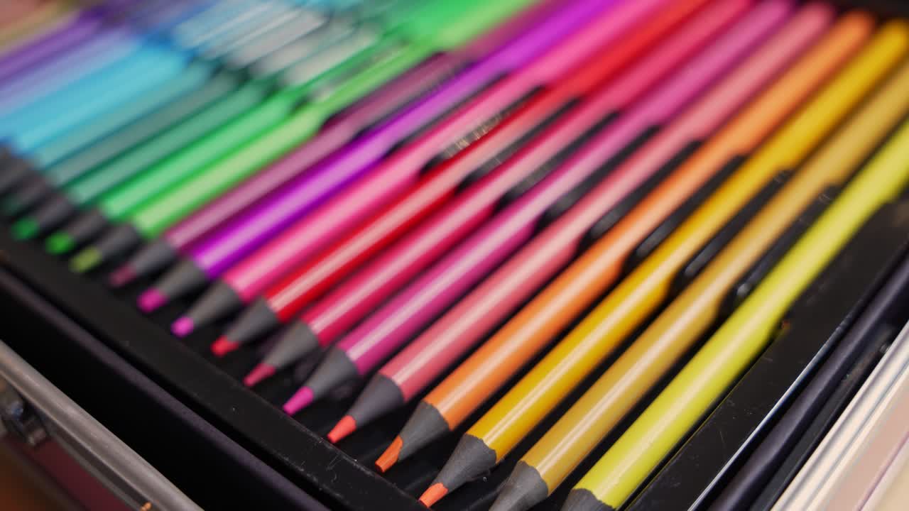 Detailed closeup of colorful pencils in warm tones arranged neatly in a case. Perfect for creativity, education, design, and artistic projects