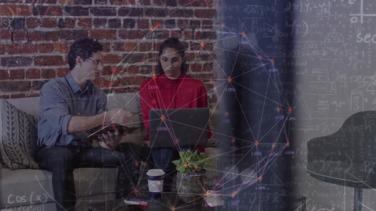 Animation of networks of connections over business people using laptop