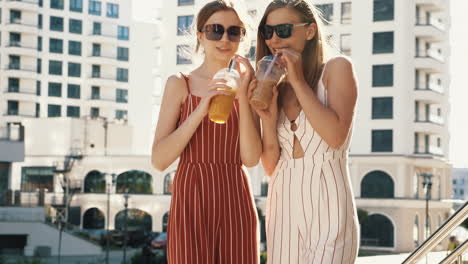 two friends enjoying drinks in the city