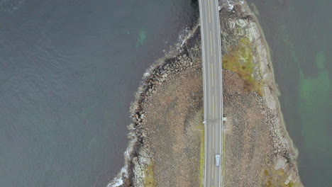 car driving on storeseisund bridge in more and romsdal county on atlantic ocean road, norway