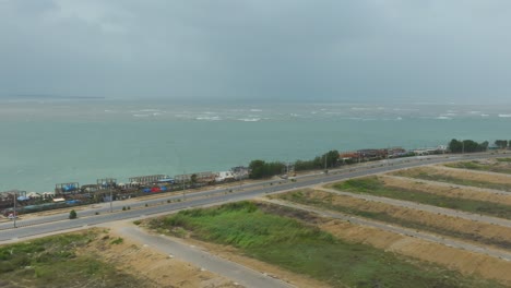 aerial view of seascape and coastal area in karachi, pakistan - famous drya restaurants are in line on the seaside