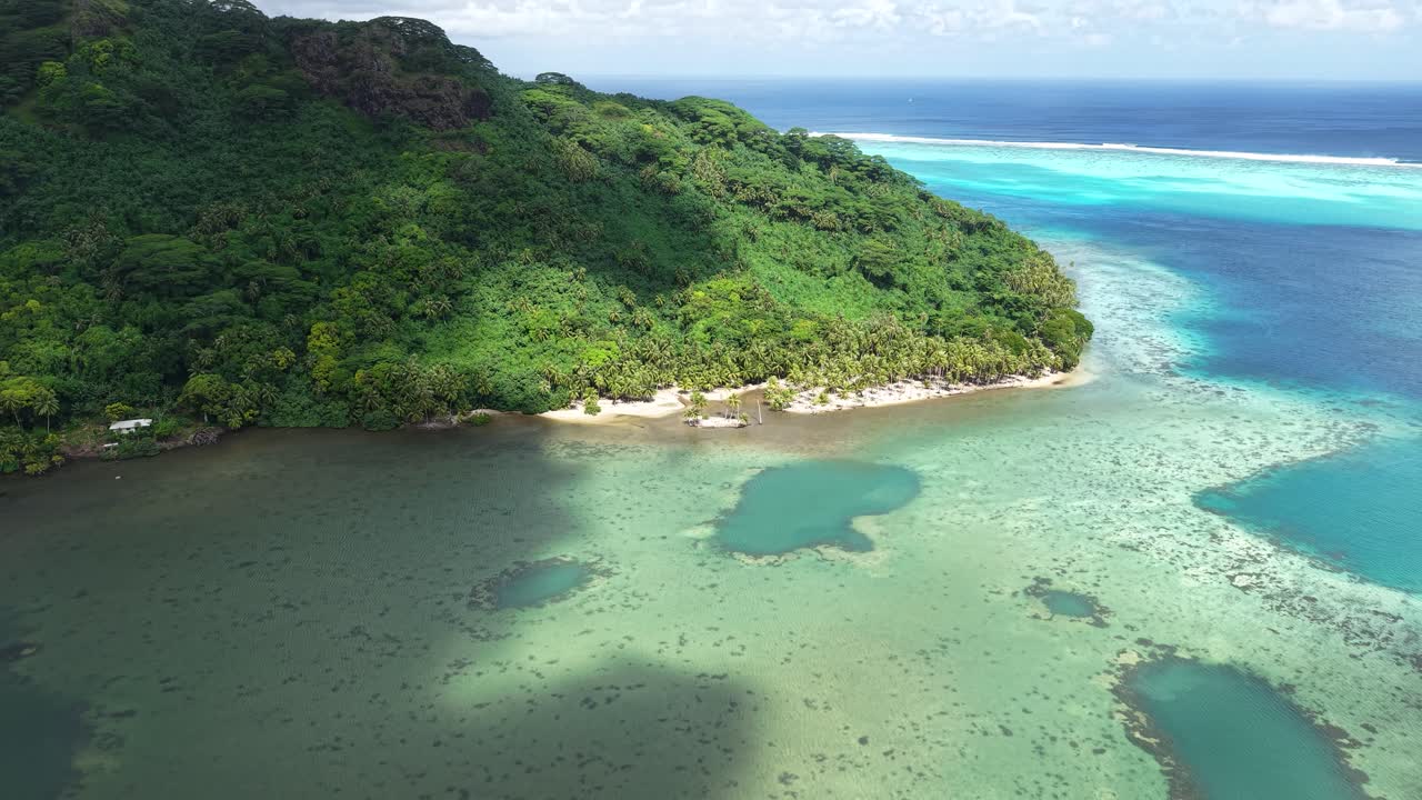 French Polynesia. Drone Shot of Scenic Island Coastline, Coral Reefs and Clouds Shadows