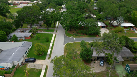aerial establishing over green lawns and trees in tampa florida suburb neighborhood