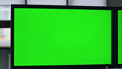 closeup chromakey screen in office. it manager working on template computer