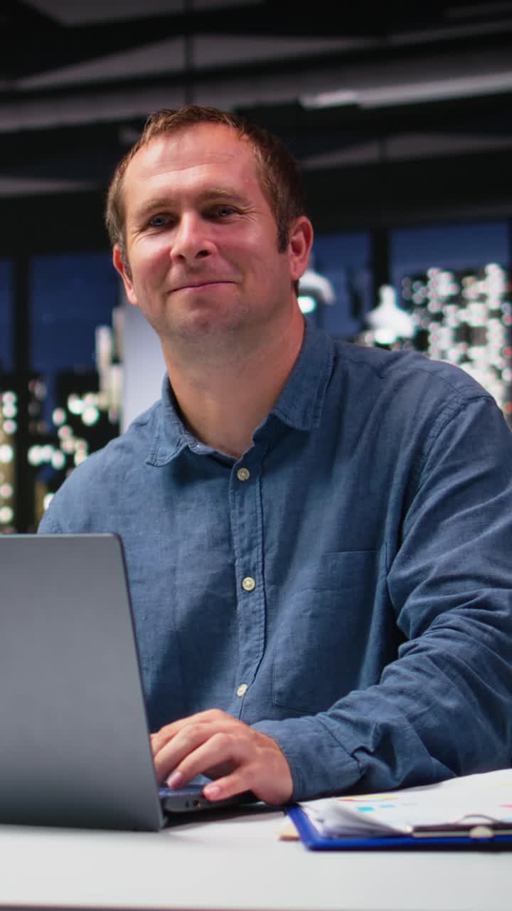 Vertical Video Male office consultant examining papers reports and typing information