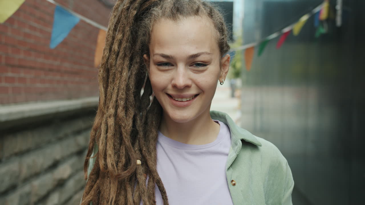 Woman with Dreadlocks in an Urban Setting