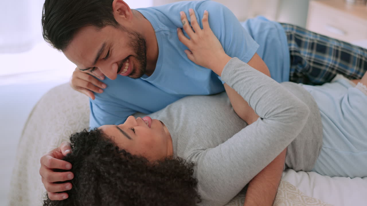 Couple talking, interracial hug