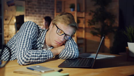 tired worker sleeping at desk