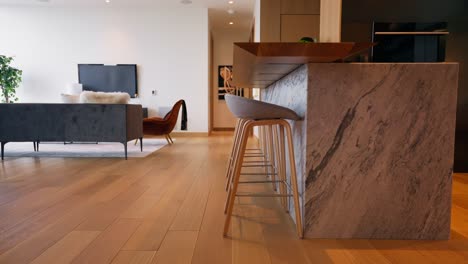 panning shot of modern kitchen bar with marble countertop