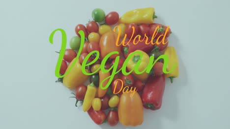 animation of world vegan day text over vegetables on white background