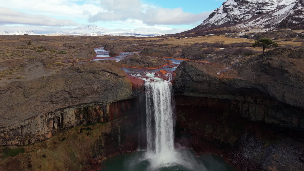 Aerial Reveal of Salto del Agrio Waterfall, Volcanic Canyon, Argentine Patagonia Slow motion Landscape