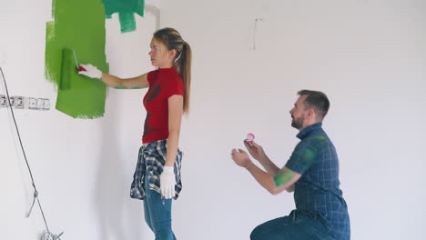 guy proposes with ring to emotional girl in light room