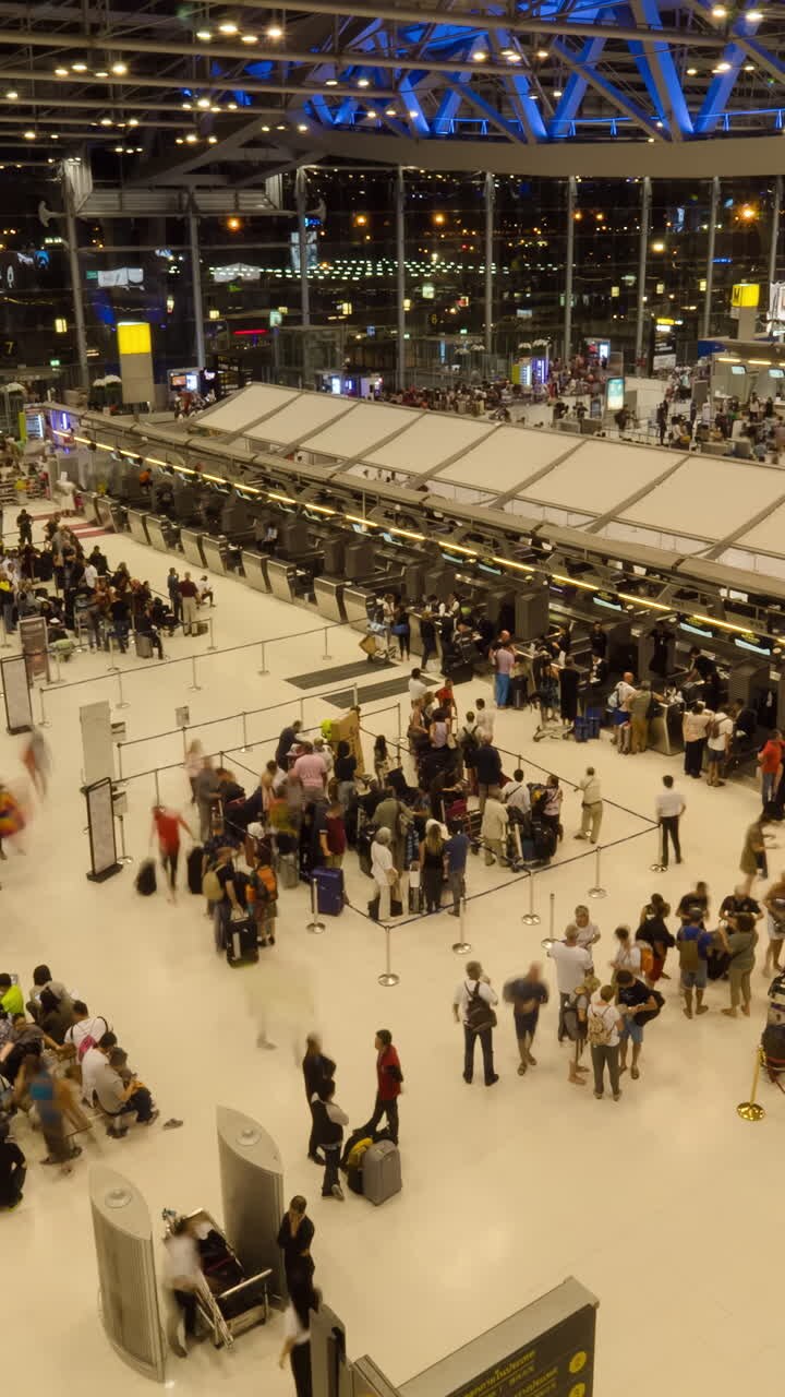 Busy Airport Check-in Area at Night