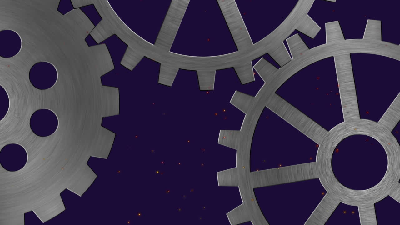 Animation of cogs over light spots on black background
