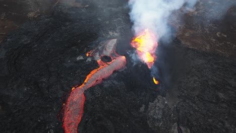 aerial view over the volcanic eruption at litli-hrutur, iceland, with lava and smoke coming out