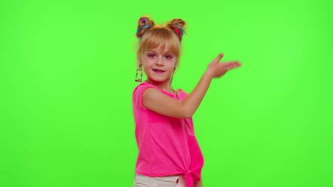 Joyful-little-kid-girl-blogger-front-of-phone-camera-record-video-enjoy-dance-content-on-chroma-key