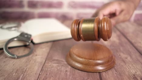 courtroom scene with gavel and handcuffs