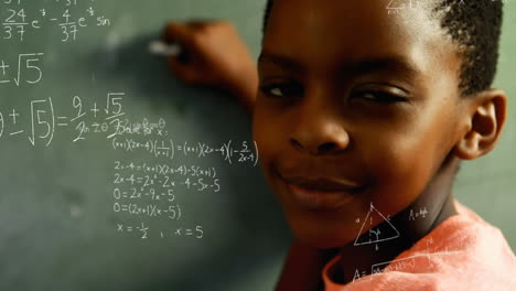 student writing on the board and mathematical equations