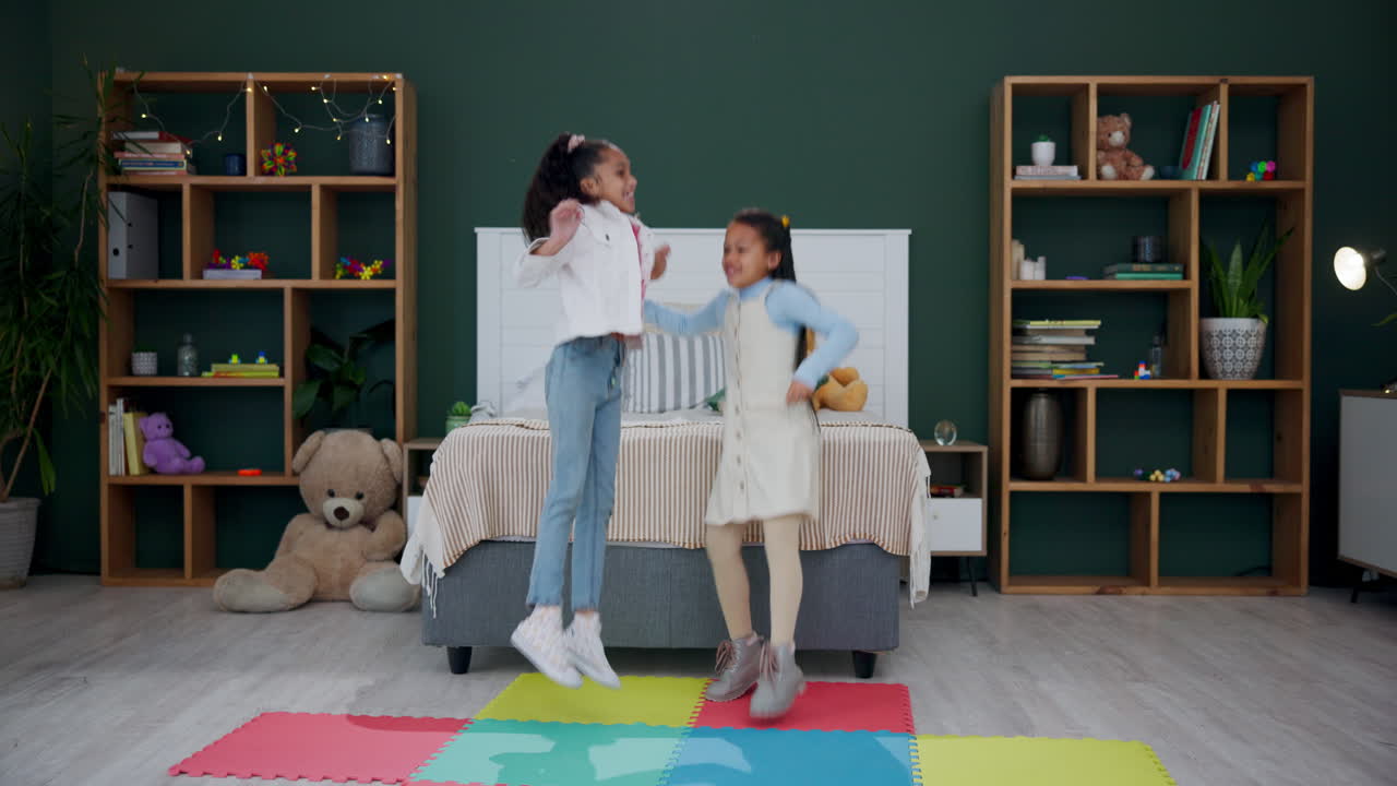 Two Young Girls Playfully Jumping in Bedroom