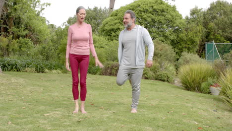 mature couple enjoying outdoor exercise together in lush green park setting