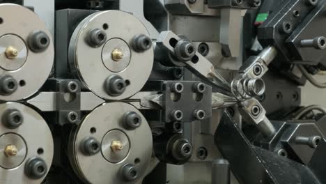 the work of the machine for the production of springs, conveyor drum type