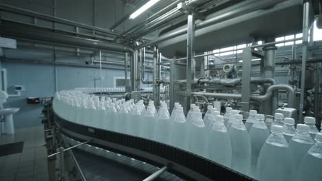 conveyor belt with bottles of drinking water at a modern beverage plant