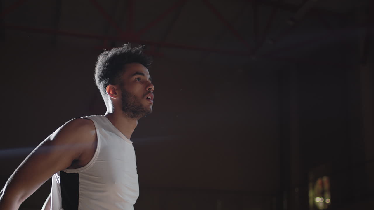 Slowmo of Basketball Player Shooting Ball