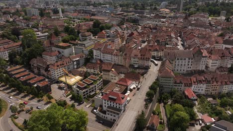 beautiful drone aerial view of aarau city with historic old town, rooftops and bridge crossing