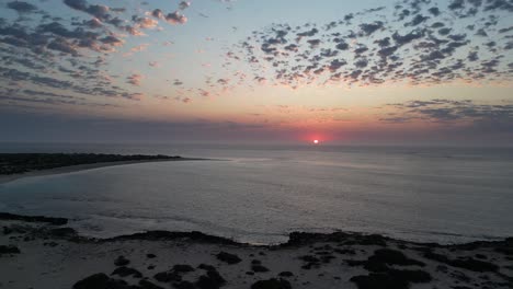 Aerial-View-over-Turquoise-Bay-in-Australia,-Epic-Sunset-and-Beautiful-Ocean