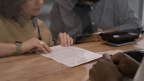 customer reviewing documents at a business