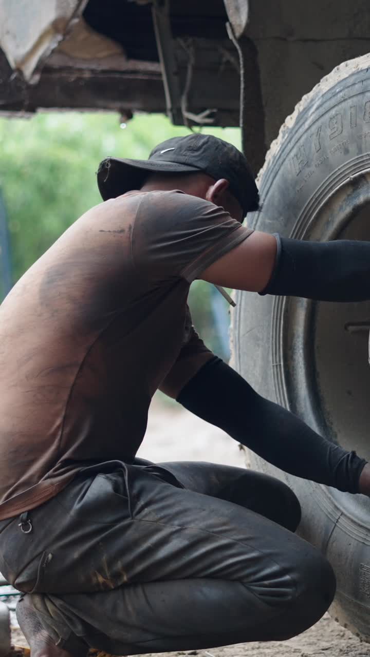 Mechanic repairing a truck tire
