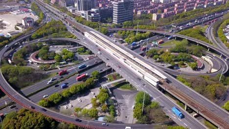 aerial view of highway junctions with roundabout. bridge roads shape circle in structure of architecture and transportation concept. top view. urban city, shanghai, china.