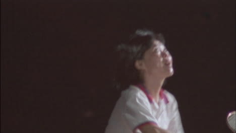 two women play a game of badminton