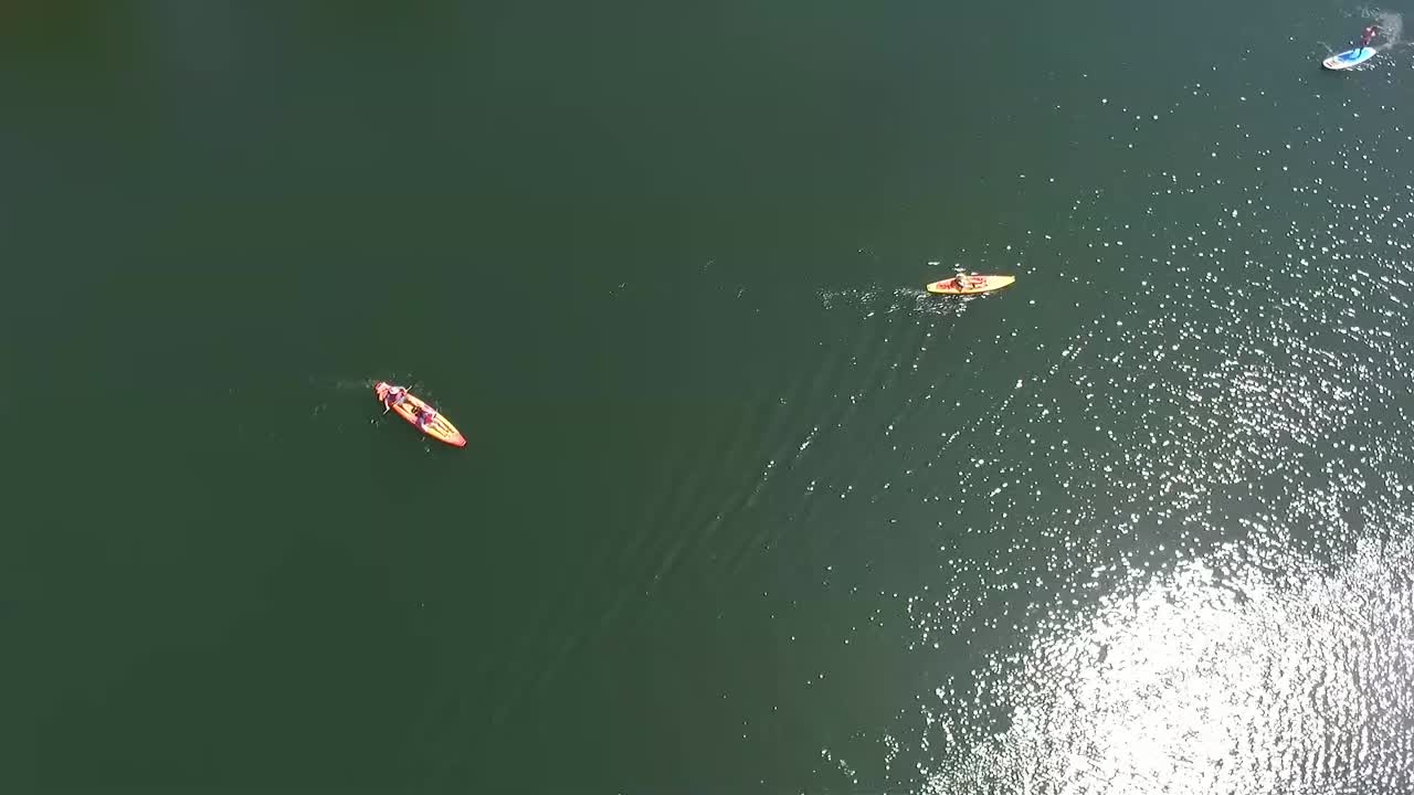 Aerial View of Kayakers and Paddleboarders on a Calm Lake