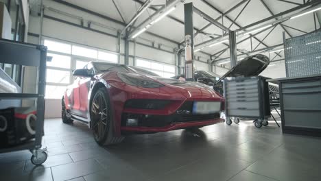 cars undergoing maintenance in auto repair shop