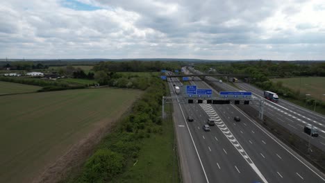 overhead motorway signage on m1 uk drone aerial view reveal