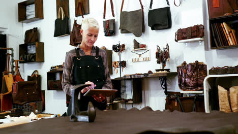 craftswoman using digital tablet