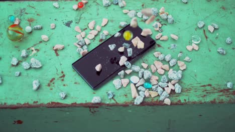 Stones-falling-and-hitting-a-smartphone-in-slow-motion