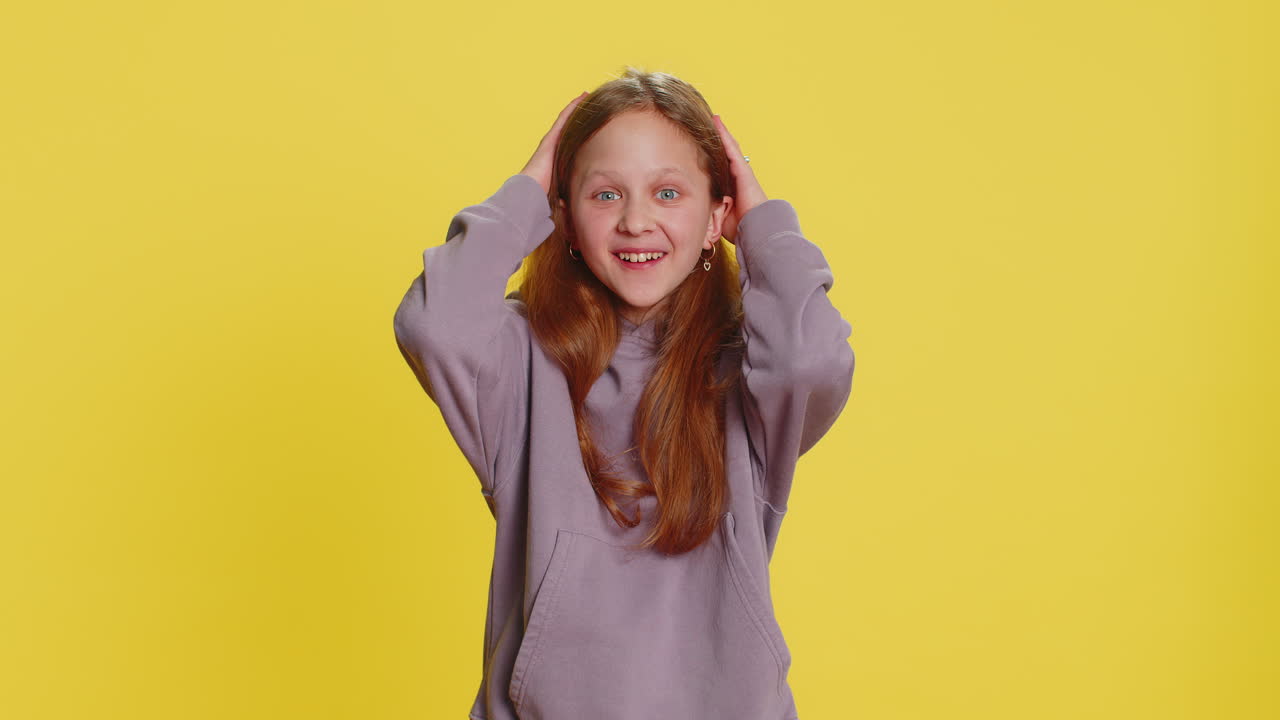 Excited child girl kid surprised shocked by sudden victory good win news celebrating wow reaction