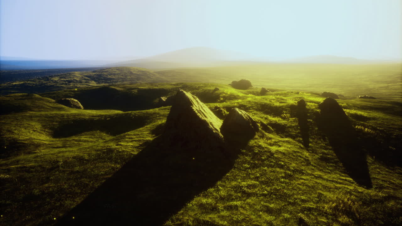 Vivid landscape bathed in golden sunlight showcases rock formations and hills