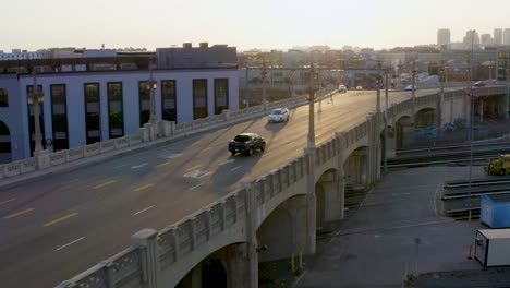 transportation concept - cars driving on city roads in los angeles
