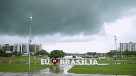 i love brasilia sign in a cloudy raining day wide open front view - tilt shot