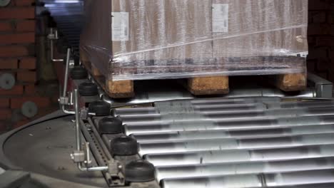 pallet with boxes on conveyor belt