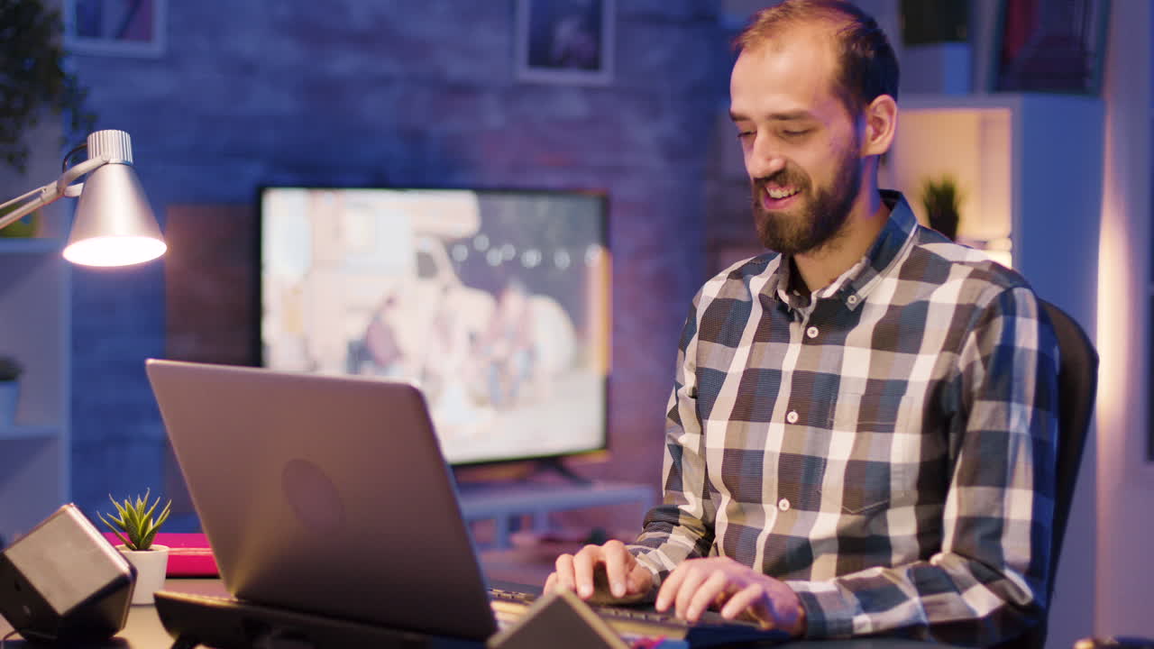 Man working on laptop at home