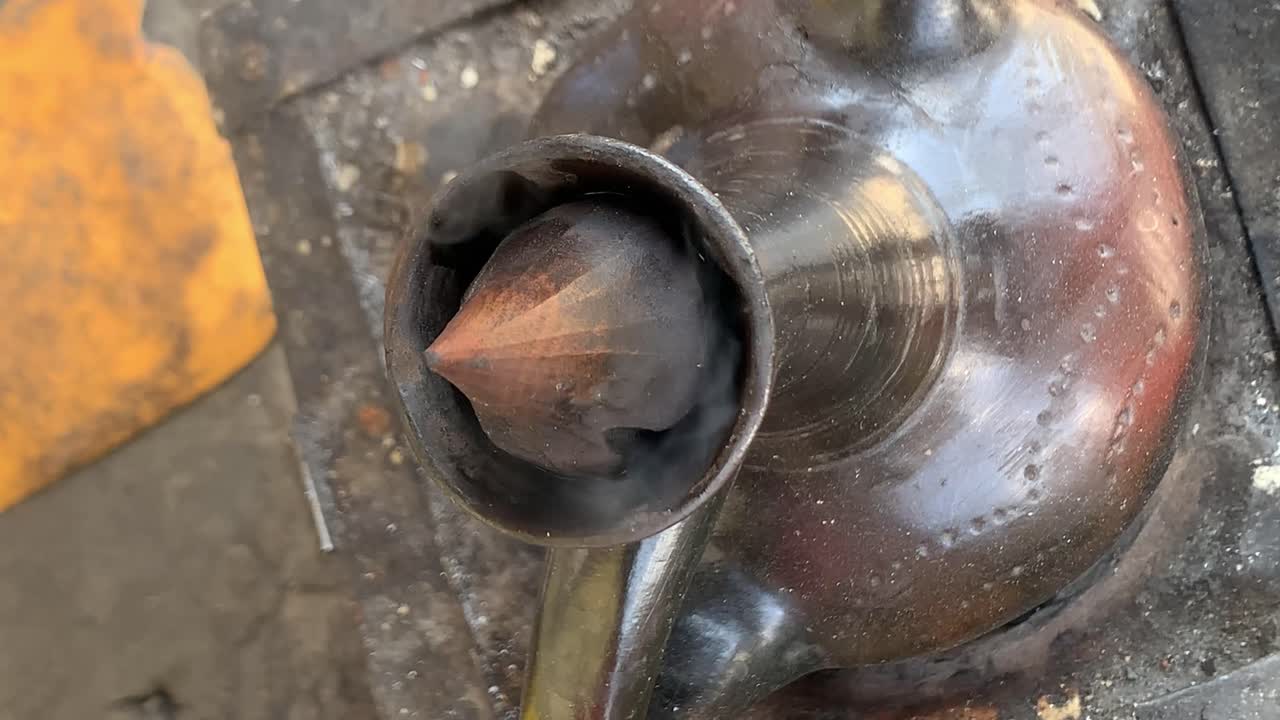 Coffee pot is steaming indicating the coffee is ready to serve