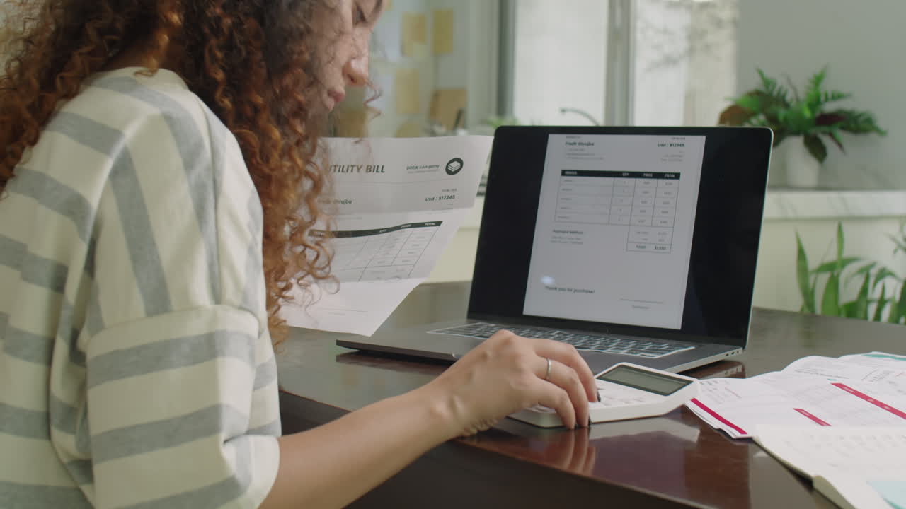 Girl Paying Utility Bill Online with Laptop at Home